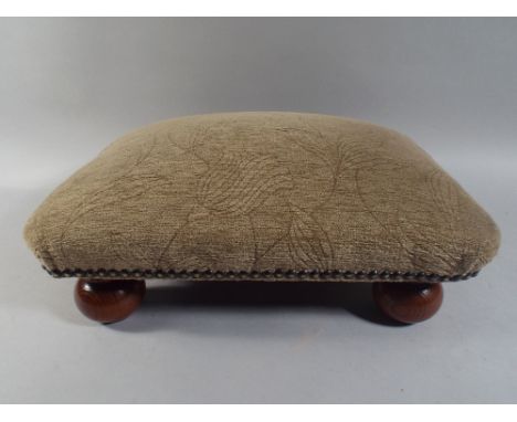 A Small Rectangular Upholstered Stool 