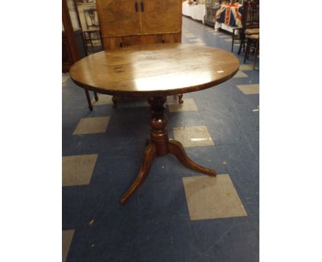 An Oak Circular Top Tripod Table 
