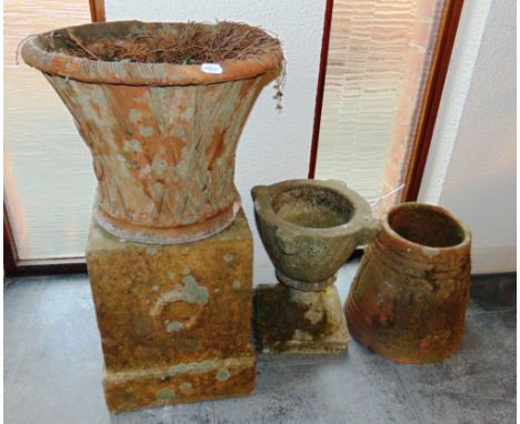 A LARGE TERRACOTTA PLANTER,  terracotta rhubarb forcer, square pedestal and a reconstituted stone birdbath