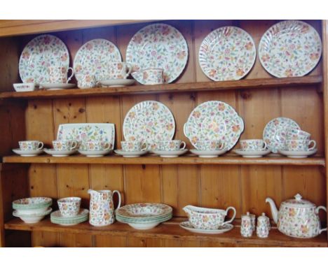 A COLLECTION OF MINTON 'HADDON HALL' PATTERN TEAWARES,  including teapot, nine cups and saucers, bowls, plates, salt and pepp