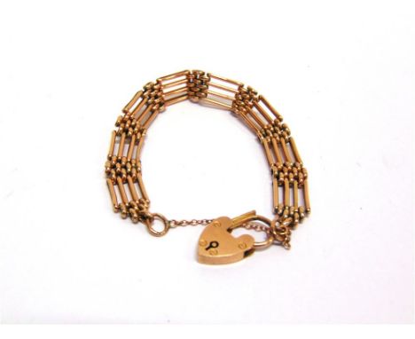 A FOUR BAR GATE BRACELET to a padlock clasp, stamped '9c', 14g gross