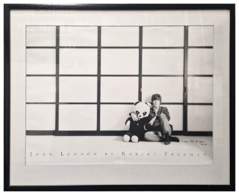 A black and white print of John Lennon taken by Robert Freeman in 1965. The framed poster has been signed by the photographer