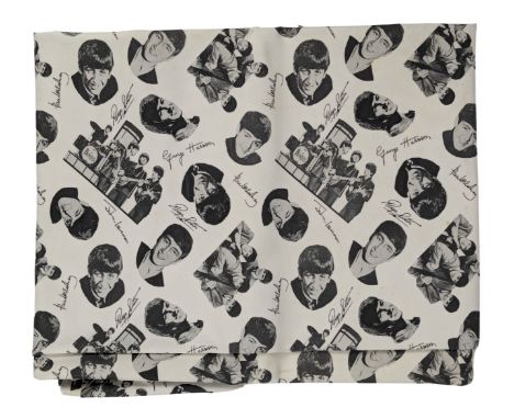 A large plastic table cloth featuring a repeating pattern of individual headshots of each Beatle, two group shots and facsimi