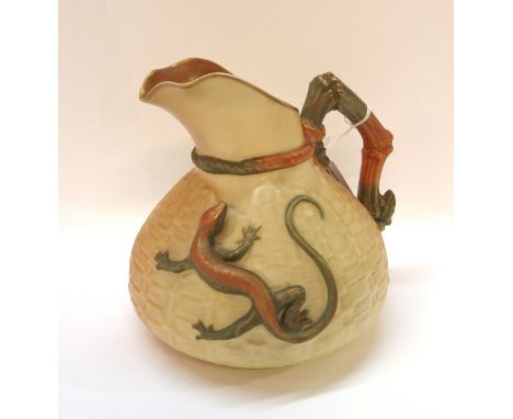 A Royal Worcester blush ivory jug, the basket work body with lizard Condition Report: 16cm high. Slight wear to gilt on top r