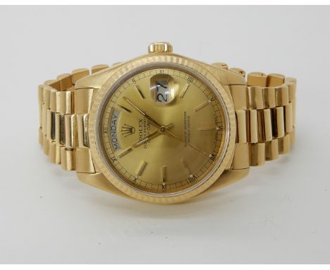 An 18ct gold Rolex Oyster Perpetual Day-Datewith day and date apertures to the gold coloured dial with gold coloured baton nu
