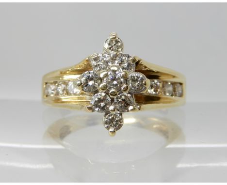 A 14k gold diamond cluster ring, set with estimated approx 0.70cts of brilliant cut diamonds, finger size M, weight 6gms Cond