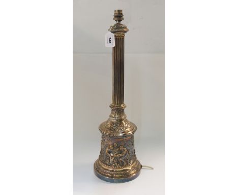 A late 19th/early 20th Century elecrotype table lamp, the reeded cylindrical stem on cylindrical base embossed with various f