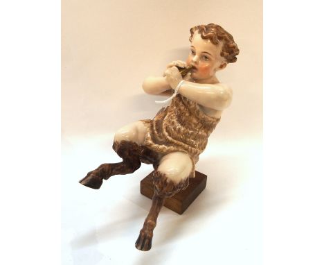 A continental porcelain figure of pan, 18cm high Condition Report: End of pipe def.