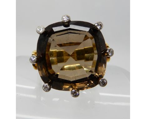 An 18ct gold smoky quartz and diamond ring, size P, weight 10.3gms Condition Report: Available upon request