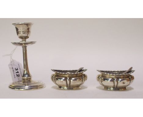 A lot comprising a silver candlestick, Sheffield 1916 and a pair of silver salts, Sheffield 1904 Condition Report: Available 