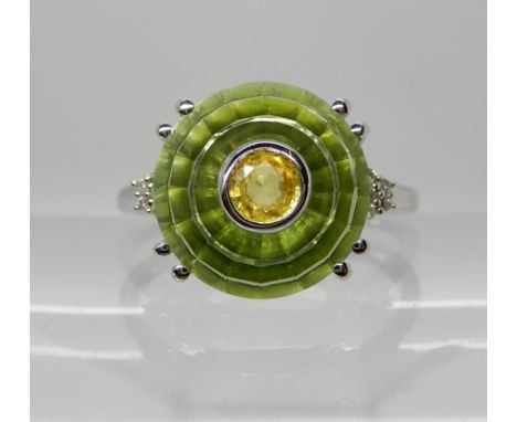 A 9ct white gold fern green 'Torus cut' quartz, yellow sapphire and diamond ring. The Torus cut was created by Glenn Lehrer a