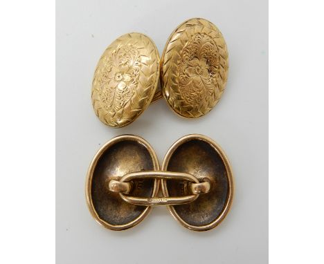 A pair of floral engraved 15ct gold cufflinks, weight approx 6.8gms Condition Report: Available upon request