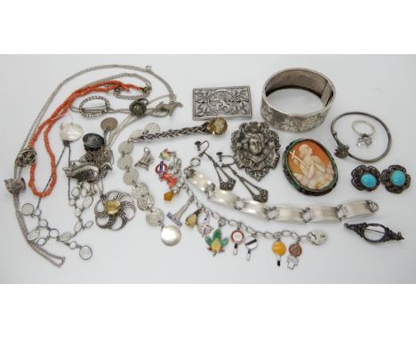 A wide silver bangle, a John Hart silver and citrine pendant, a silver charm bracelet with enamel charms, a moonstone necklac