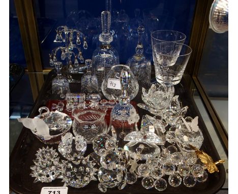 A collection of Swarovski pieces including water lily candlestick, bunch of grapes, hedgehogs, other animals and various othe