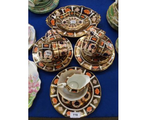 A Royal Crown Derby Imari pattern teaset comprising six cups, saucers and plates, cake plate, oval acorn handled dish, jam di