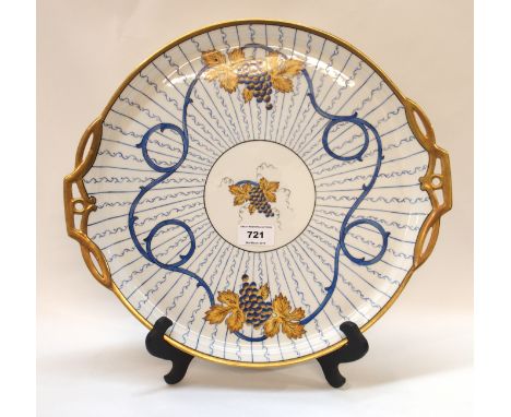 A porcelain tray with hand painted decoration, 35.5cm diameter Condition Report: (end of pipe def). 