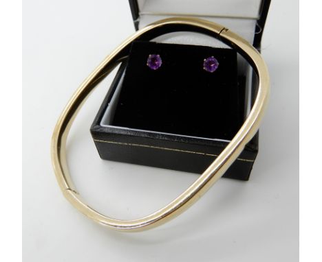 A 9ct gold bangle and a pair of yellow metal amethyst earrings, weight approx 10.2gms Condition Report: Available upon reques