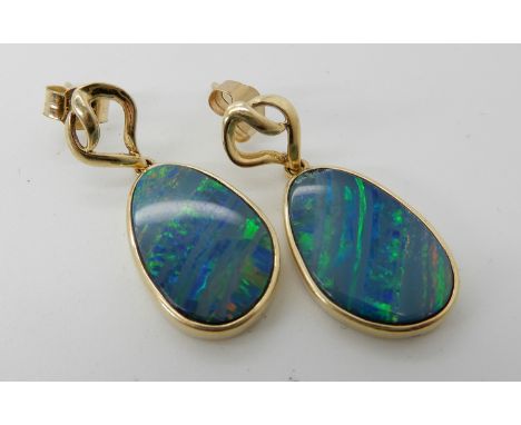 A pair of 14ct gold opal doublet earrings, length of drop 2.7cm, weight 3.9gms Condition Report: Available upon request