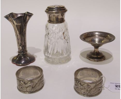 A silver mounted sugar shaker, a silver rose flute vase, 11cm high, a small silver comport, 8cm diameter x 5cm high, various 