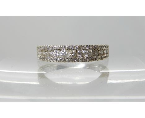An 18ct gold diamond set wedding band to match the previous lot 53, set with estimated approx 0.50cts of brilliant cut diamon