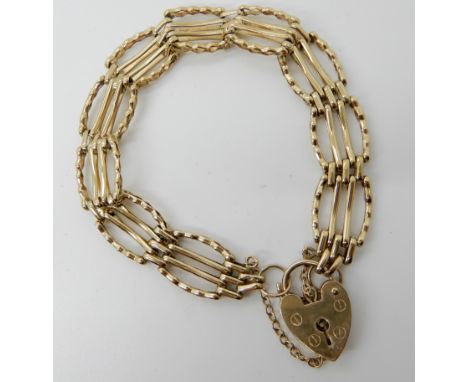 A 9ct gold decorative gate bracelet, length approx 18cm, weight 11.9gms Condition Report: Available upon request