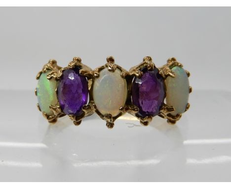 A 9ct gold amethyst and opal five stone ring, P1/2, weight 3.2gms Condition Report: Available upon request