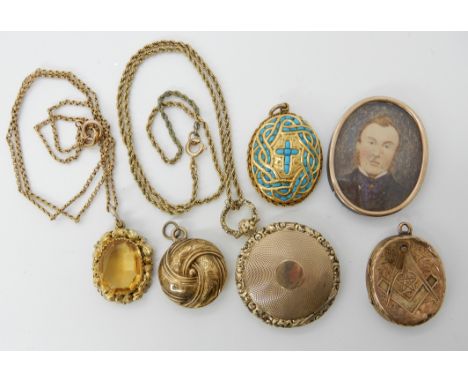 A collection of gold and yellow metal items to include a locket and a citrine pendant Condition Report: Condition report not 