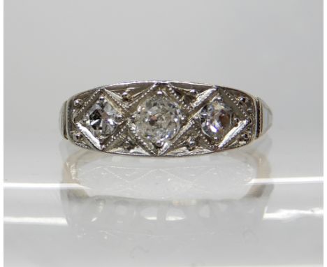 An 18ct gold Art Deco three stone diamond ring, diamonds estimated approx 0.25cts, finger size L1/2, weight 2.5gms Condition 