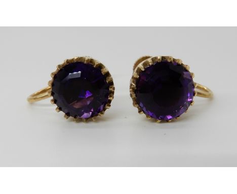 A pair of 9ct gold amethyst screw back earrings, diameter of the amethyst 9.2mm, weight 3.4gms Condition Report: Available up