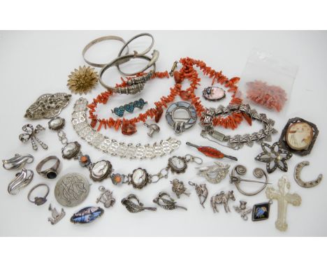 A silver dolphin bangle, a string of coral beads (af), a Victorian style bracelet and other items Condition Report: Condition