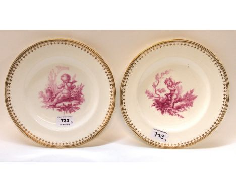 A pair of Minton puce decorated plates, each painted with a cherub, 23cm diameter Condition Report: One plate is slight darke