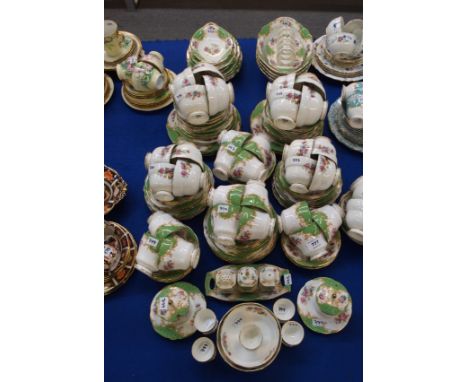 An extensive Paragon Rockingham tea and coffee set, with 11 breakfast cups, 8 tea cups, 14 coffee cups, 26 saucers, 35 side p