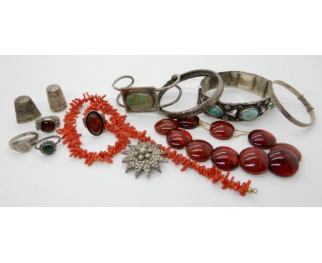 A continental silver bangle set with faux turquoise, a string of coral beads and other items Condition Report: Condition repo