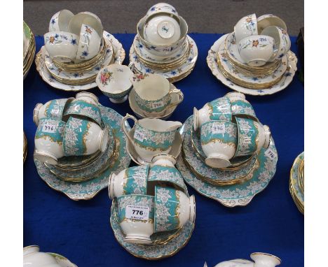 A Royal Albert Enchantment pattern teaset comprising thirteen cups, twelve saucers and plates, two cake plates, two milk jugs