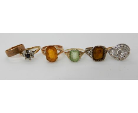 A collection of gold and yellow metal gem set rings (5) and a 9ct wedding band Condition Report: Available upon request