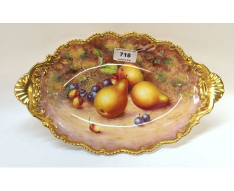 A Royal Worcester dish, painted with pears and cherries on a mossy ground, signed Freeman, with gilt rim and shell moulded ha
