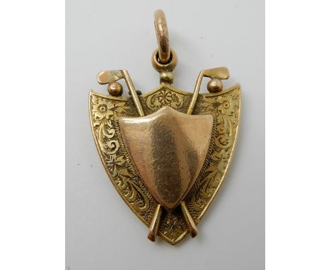 A 9ct gold golfing themed medallion weight approx 10.4gms Condition Report: Available upon request