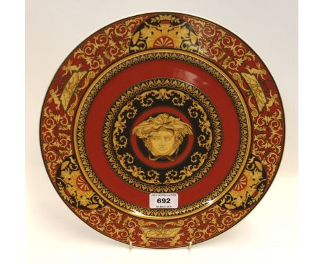 A Rosenthal Versace Medusa plate in box Condition Report: A few light surface scratches. The plate is dirty and needs a wash.