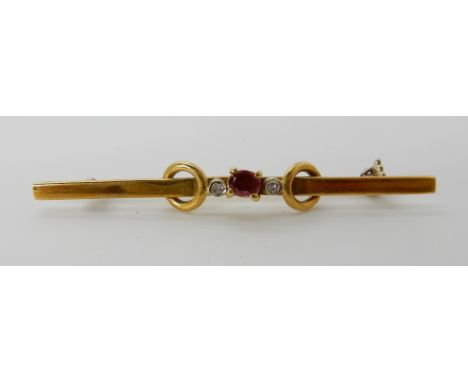 An 18ct gold ruby and diamond brooch, 4.8cm, weight approx 3.2gms Condition Report: Available upon request