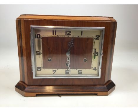 A 1930s square mantle multi chime clock. With painted numbers and ornate metal hands.With key and pendulumW:33cm x D:18cm x H