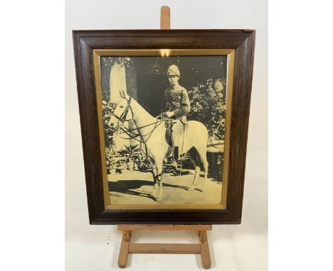 A photographic print of Winston Churchill in oak frame with a gilt internal mount. W:50cm x H:60cm.