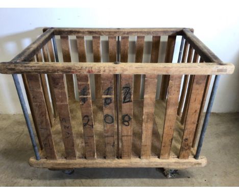 A Factory bobbin cart, for use as a log or laundry basket. W:110cm x D:70cm x H:83cm.
