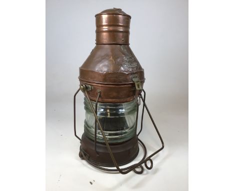 A large vintage copper and brass ships lamp not under command with original glassW:30cm x H:60cm