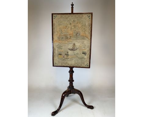 A Victorian mahogany fire screen with tapestry. 
