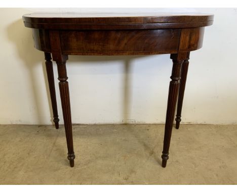 A Georgian mahogany inlaid card table with reeded fluted legs W:91cm x D:45cm x H:74cm