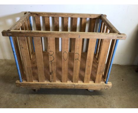 A Factory bobbin cart, for use as a log or laundry basket. W:110cm x D:70cm x H:83cm.