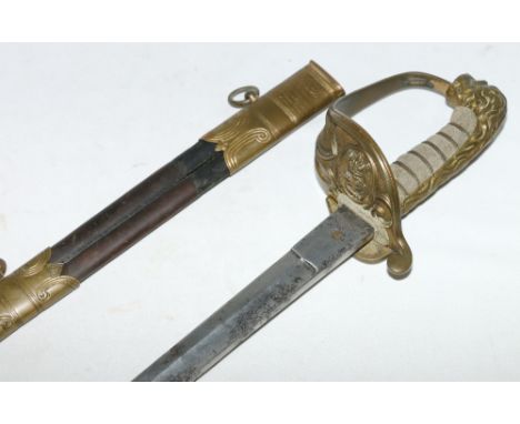 British Naval Officer's sword having etched fullered curving blade, gilded brass guard with naval cartouche, fish skin grip, 