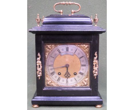 Early 20th century Ebonised Mantle clock, with ormulu brass dial, brass veneer and brass finials, by Morath Brothers, Liverpo
