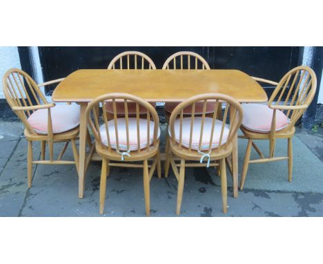 Ercol mid 20th century light oak dining table, plus six (4+2) chairs 