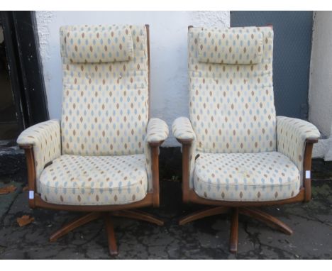 Pair of Ercol mid 20th century oak framed upholstered swivel armchairs. Approx. 114cms H 